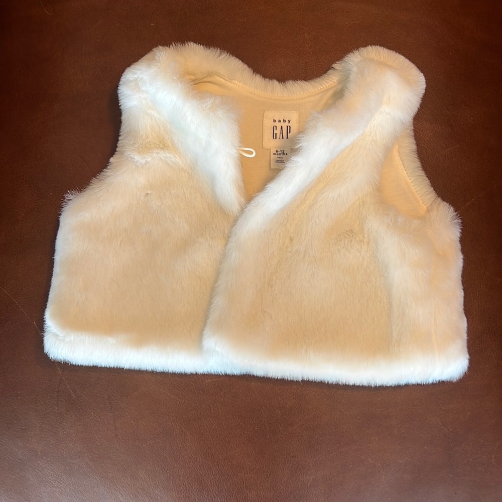 Gently worn baby gap white fur vest.